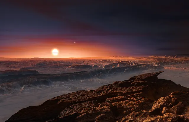 Ilustración del ESO de la superficie rocosa de Próxima b con su estrella roja en el cielo; no es una foto